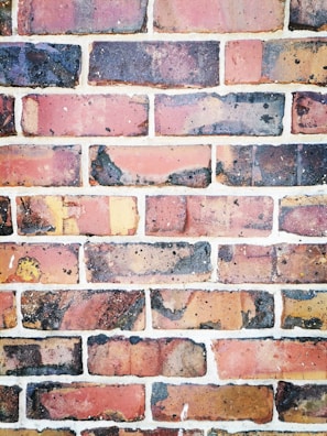 Rustic brick tiles from demolition laid out for reuse