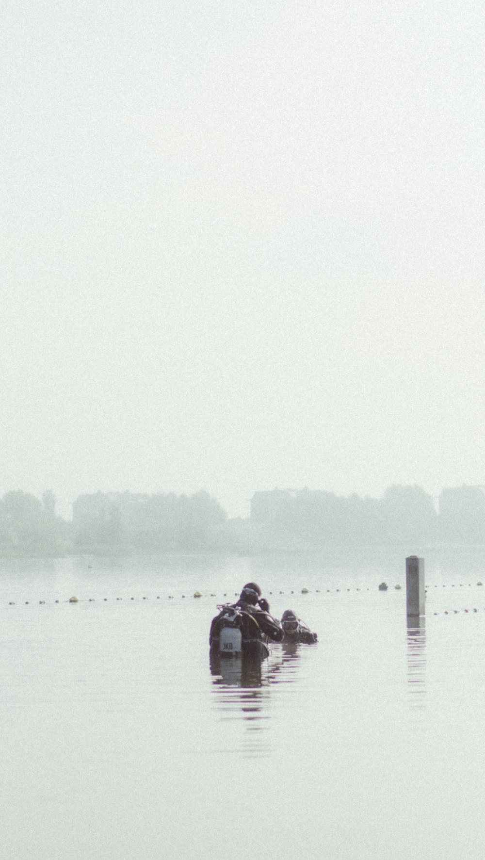 two people in a small boat in a body of water