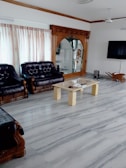 Living room floor showing a dramatic change from dusty and dull to polished and fresh.