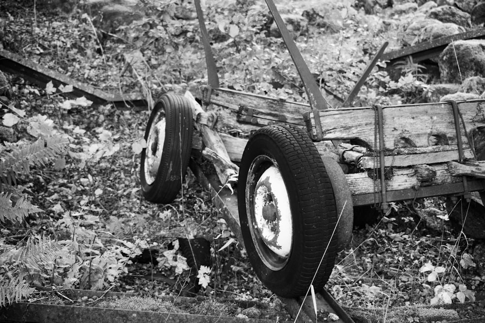 a black and white photo of a broken down truck