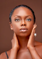 Soft-focus portrait of a model showcasing smooth, luminous complexion.