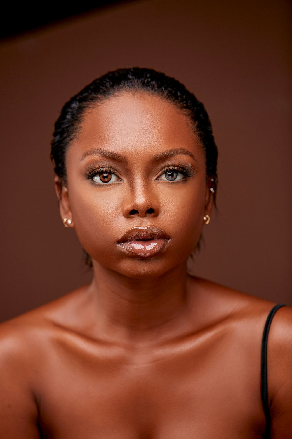 a woman in a black dress posing for a picture