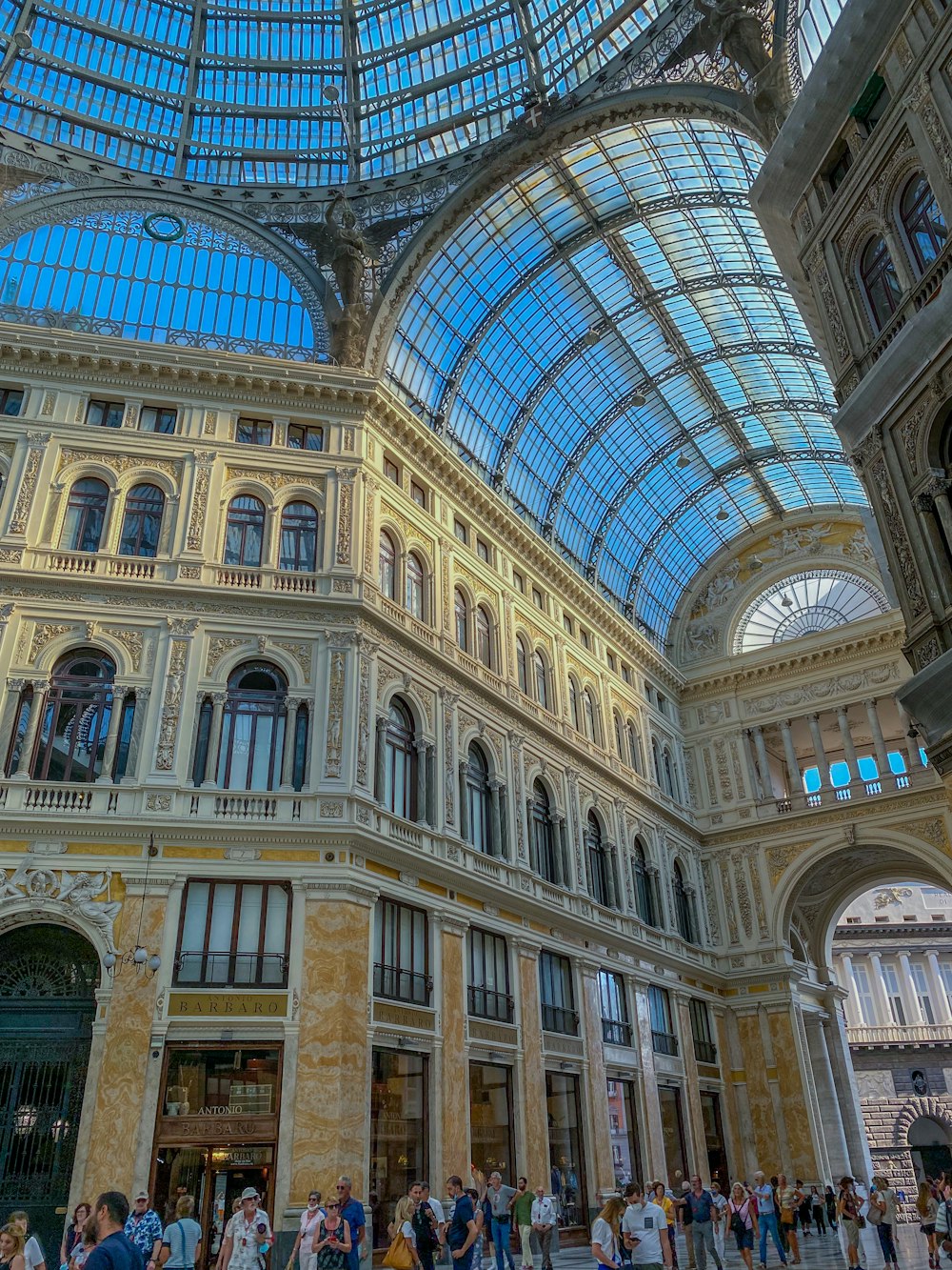 a group of people standing inside of a building