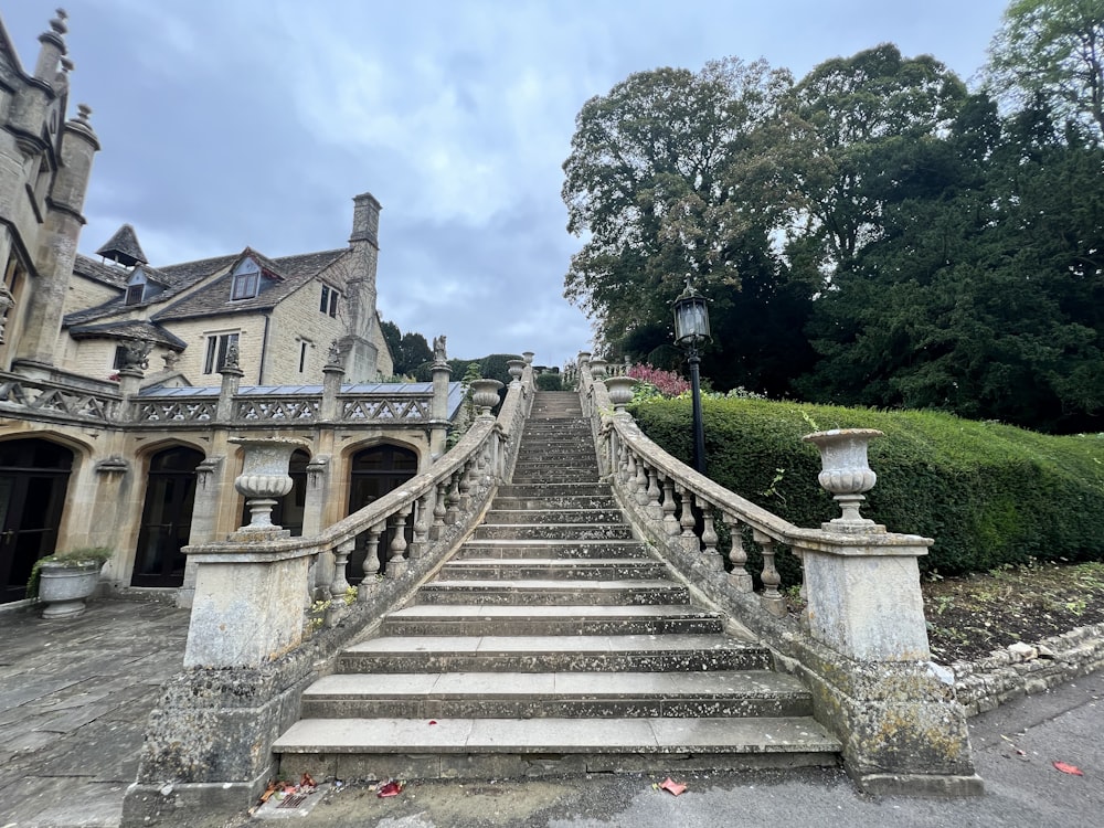 a stone staircase leading up to a castle like building