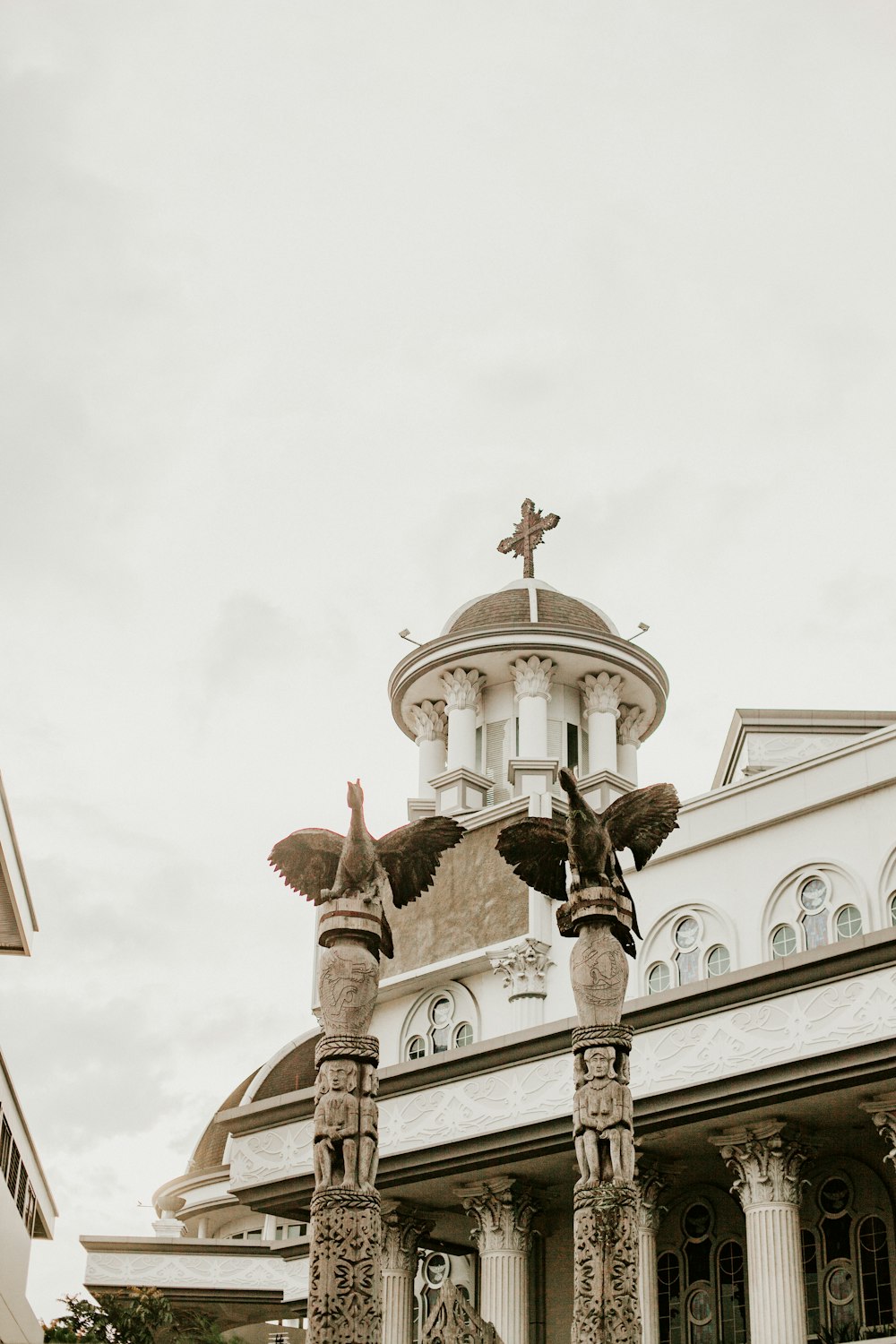 a large building with a cross on top of it