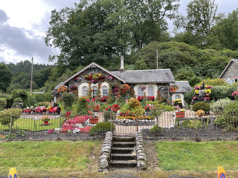 a house with flowers on the front of it