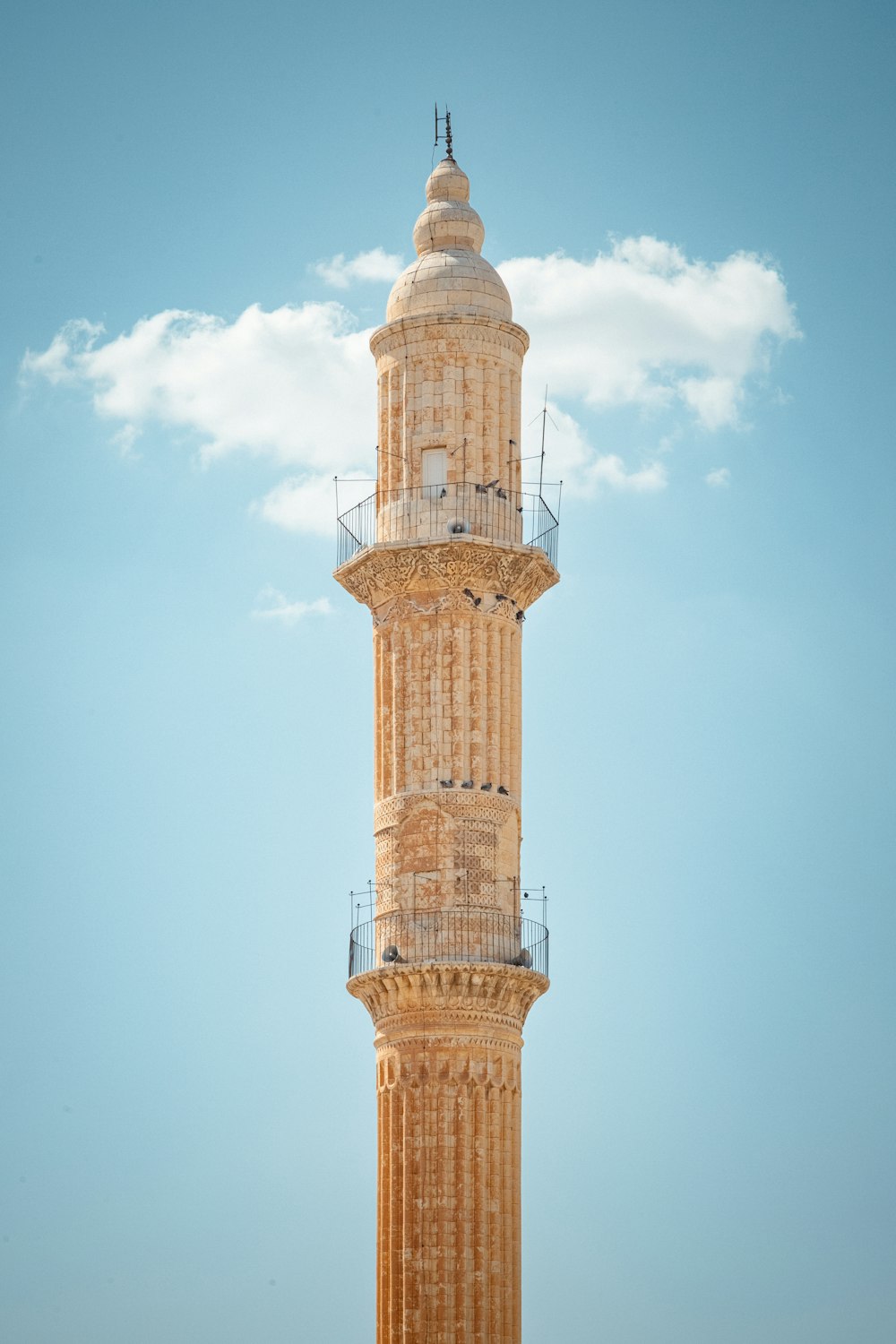 a tall tower with a clock on the top of it