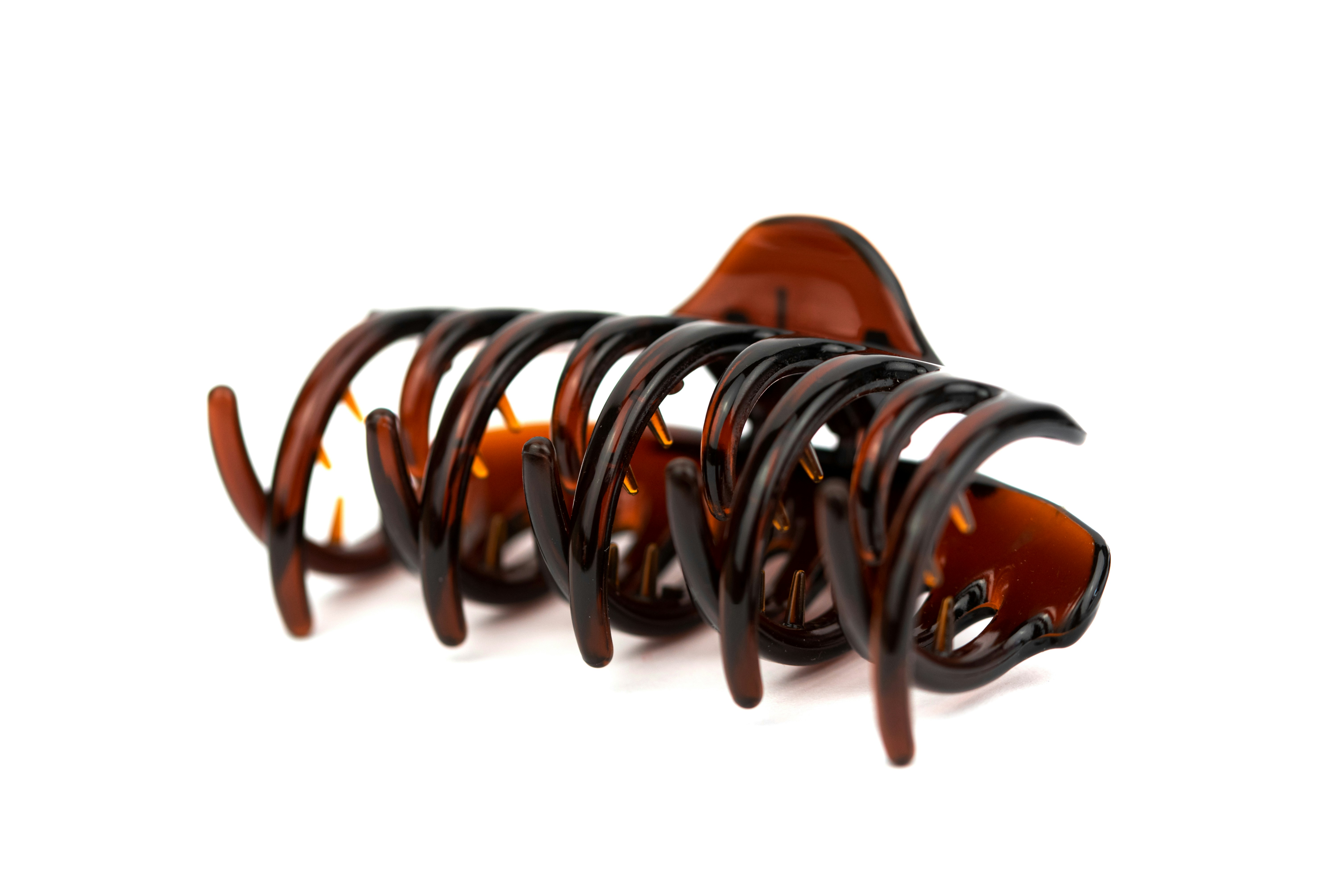 brown hair clip isolated on the white background
