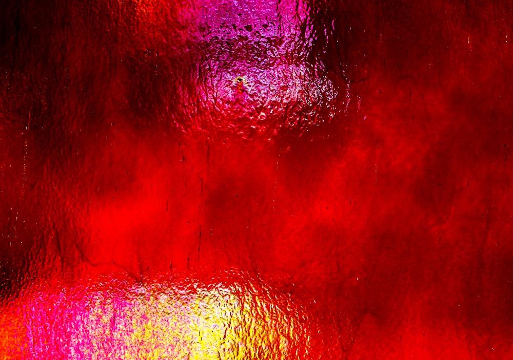 a close up of a red and yellow background