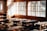 A rustic classroom setting with wooden desks and chairs is illuminated by soft, warm sunlight streaming through large windows. The sunlight casts gentle shadows across the room, emphasizing the natural wood tones of the furniture and walls.
