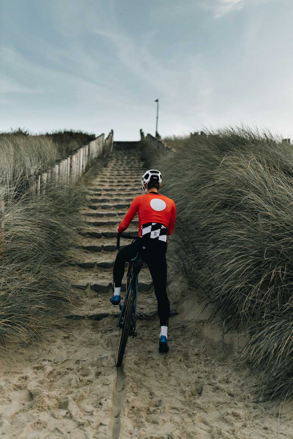 a man riding a bike down a set of stairs