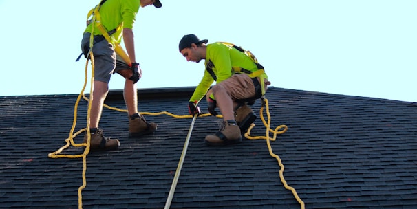 a couple of people that are on a roof