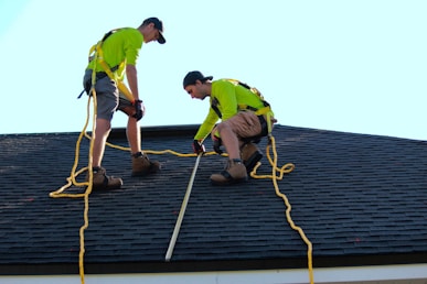 a couple of people that are on a roof