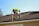 a man working on a roof with a power drill