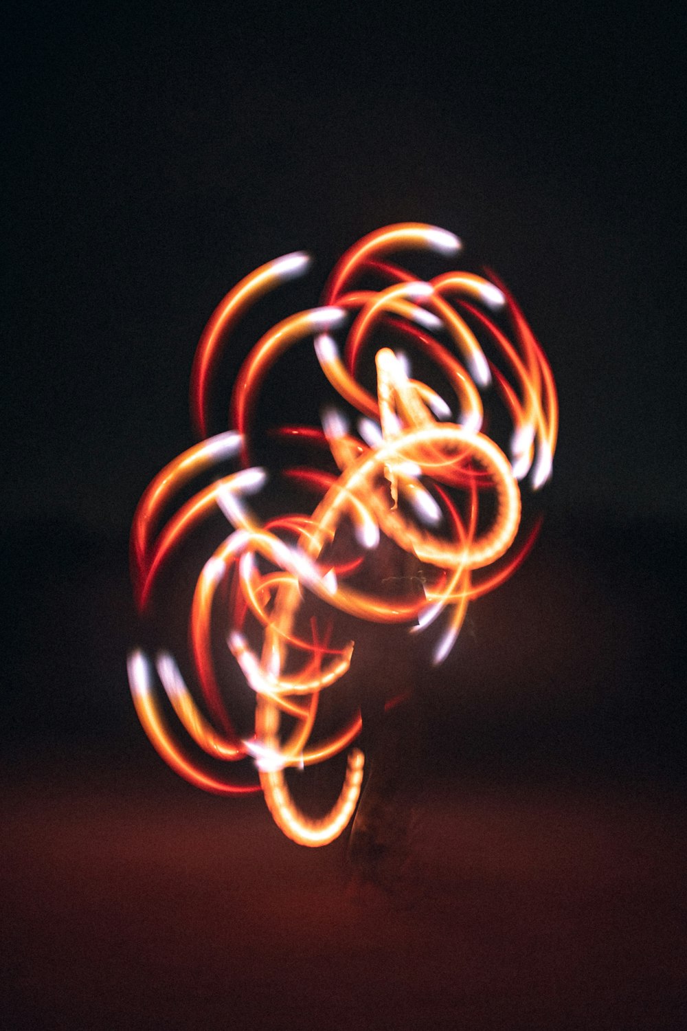 a blurry photo of a person holding a light