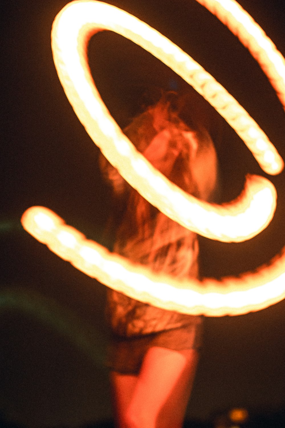 a man holding a fire hose in his hand