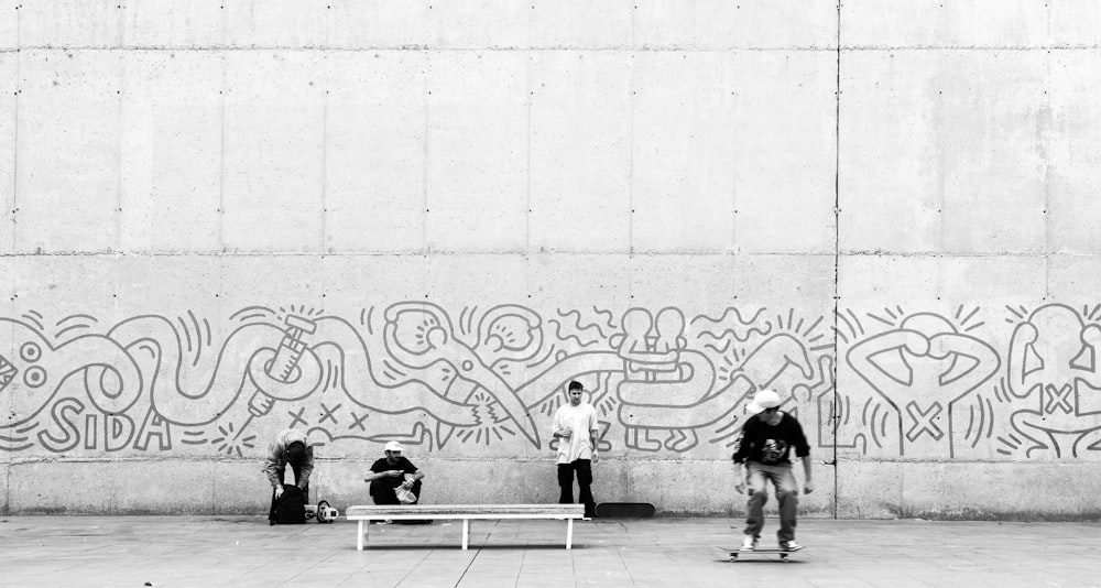 a black and white photo of a man on a skateboard