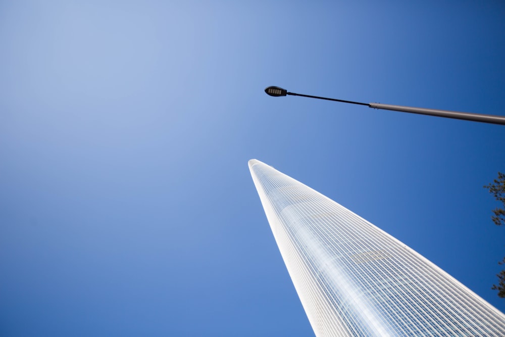 a tall building with a street light in front of it