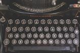 a close up of an old fashioned typewriter