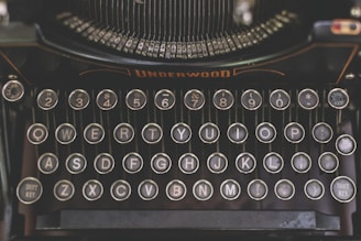 a close up of an old fashioned typewriter