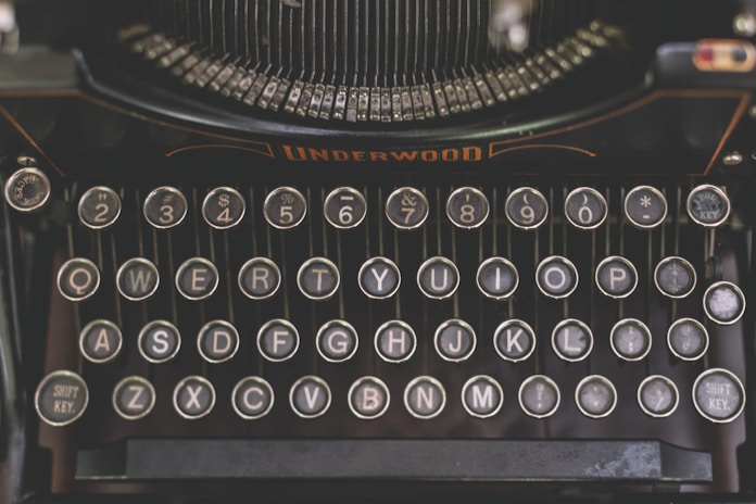 a close up of an old fashioned typewriter