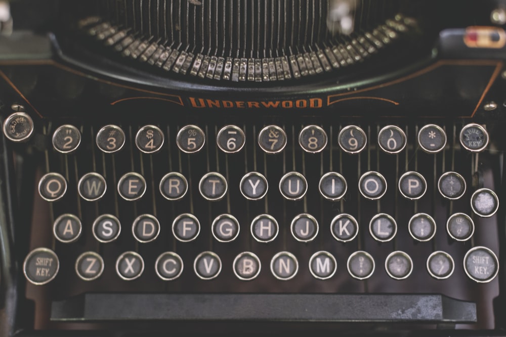 a close up of an old fashioned typewriter