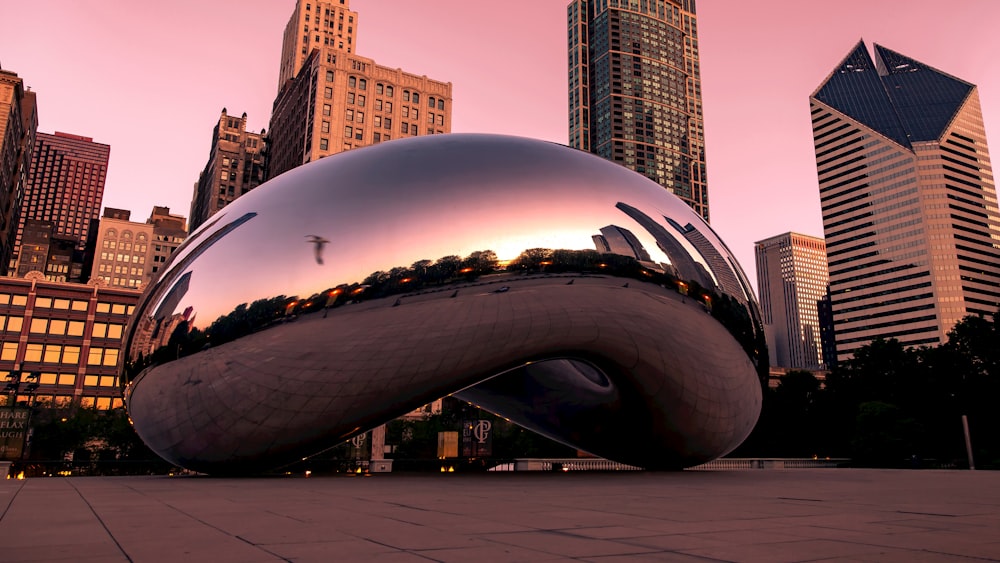 a large shiny object in the middle of a city