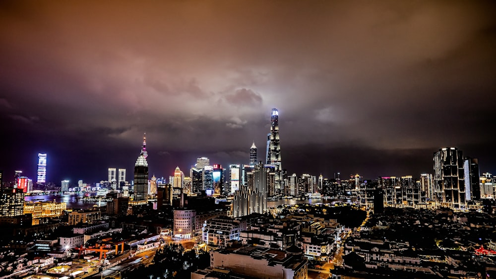 a view of a city at night from the top of a building