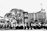 Black and white photo of a civil rights march blending into a modern protest for global identity.