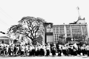 Black and white photo of a civil rights march blending into a modern protest for global identity.