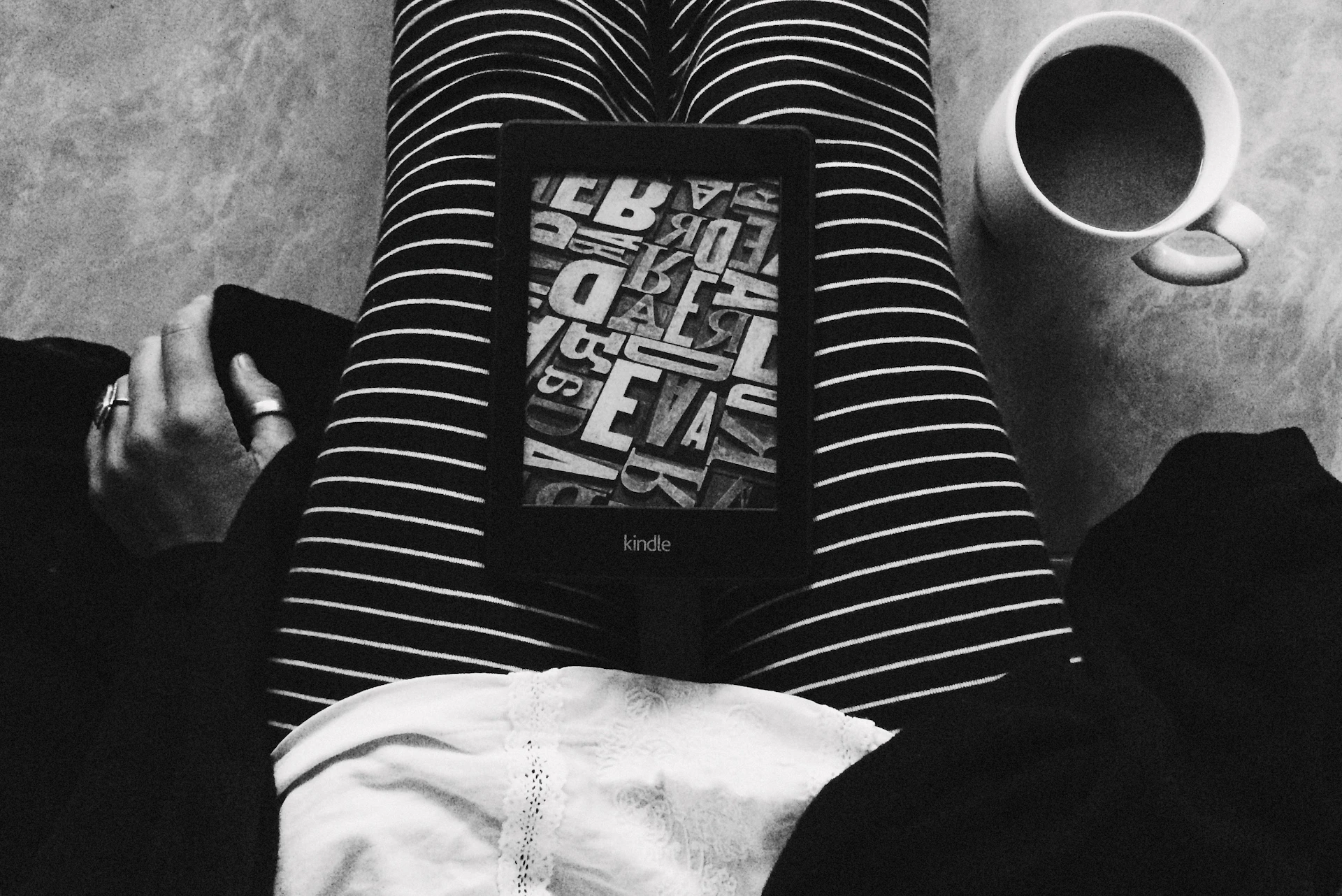 a person sitting on the floor with their legs crossed