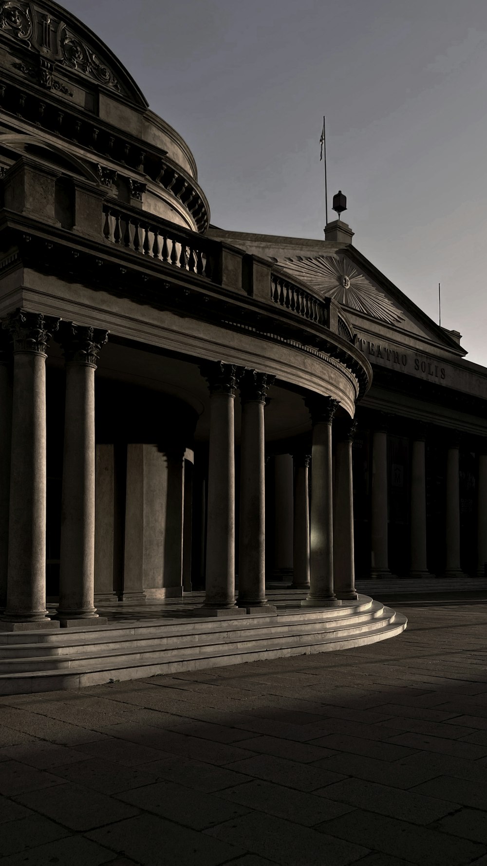 a black and white photo of a building with columns