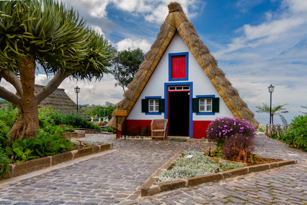 A customizable wendy house with bright colors and a welcoming porch, ideal for home or farm.