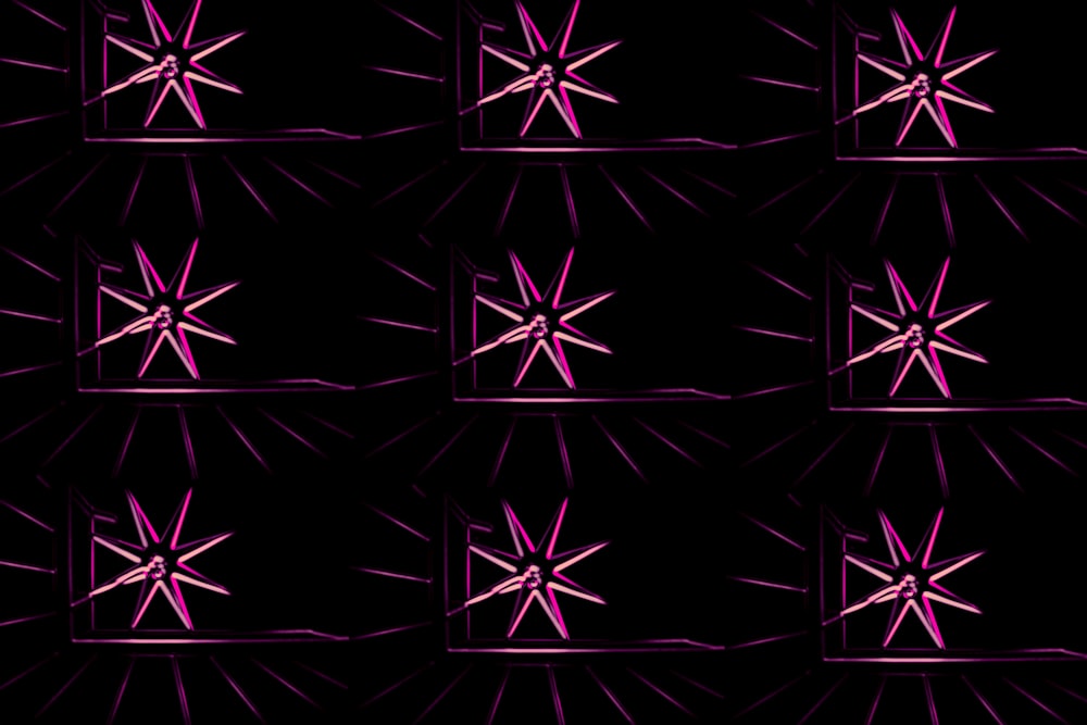 a black background with a pink star pattern