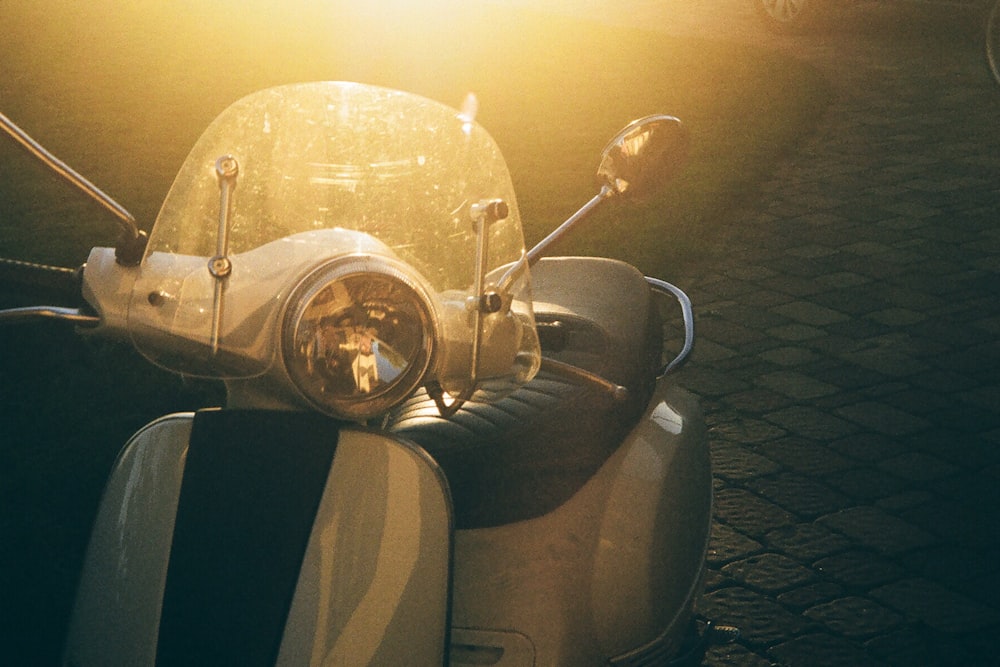 a scooter parked on the side of the road