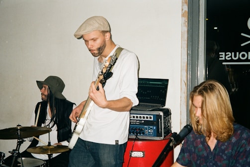 The trio jamming together in a cozy Wiltshire practice space.