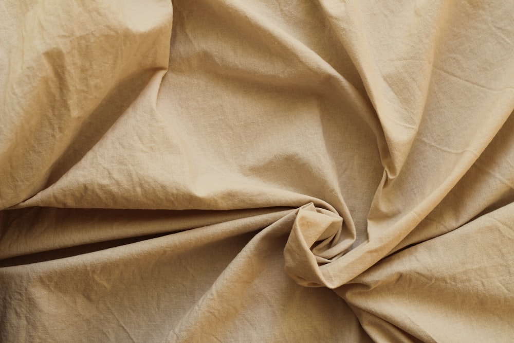 a close up view of a tan fabric