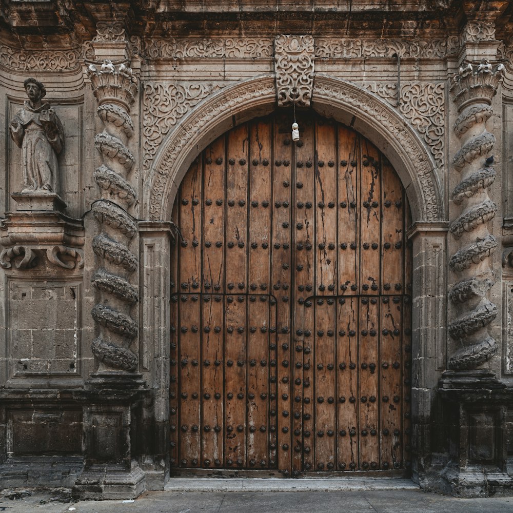 a large wooden door in a stone building