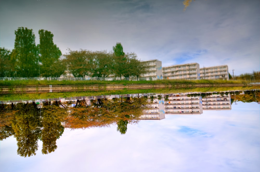 a body of water with buildings in the background