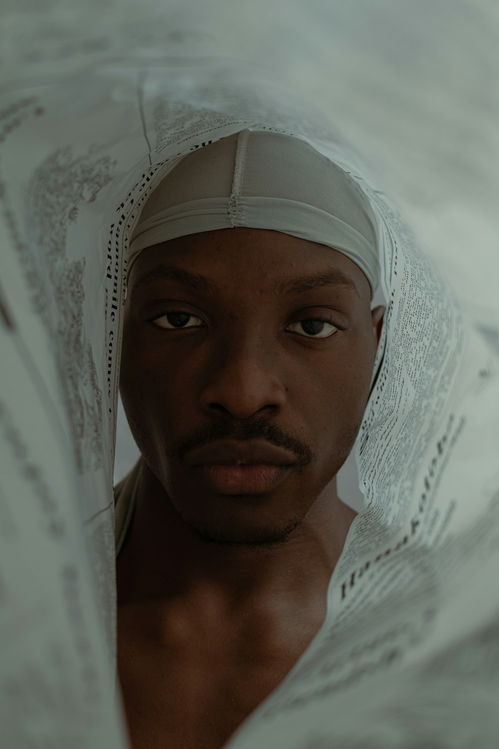 a man with a head scarf around his head