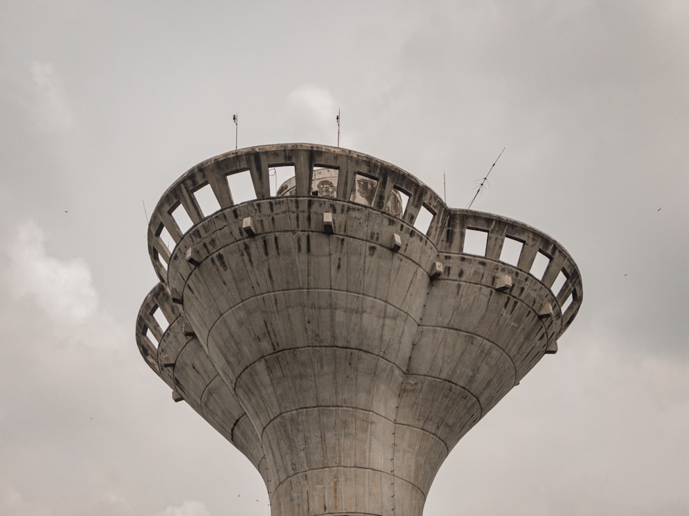 a very tall tower with a clock on it's side