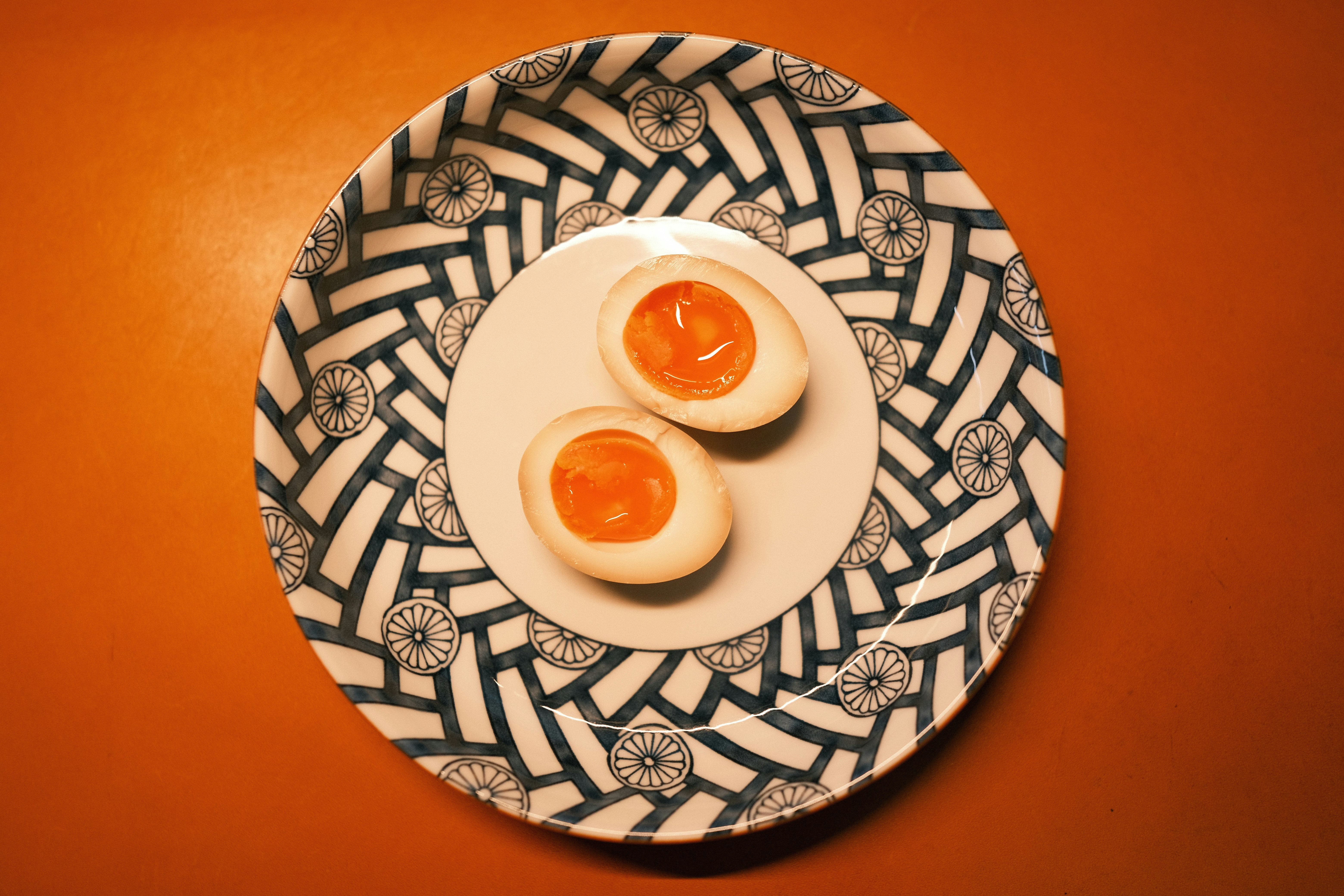 Two boiled eggs on a plate on a table