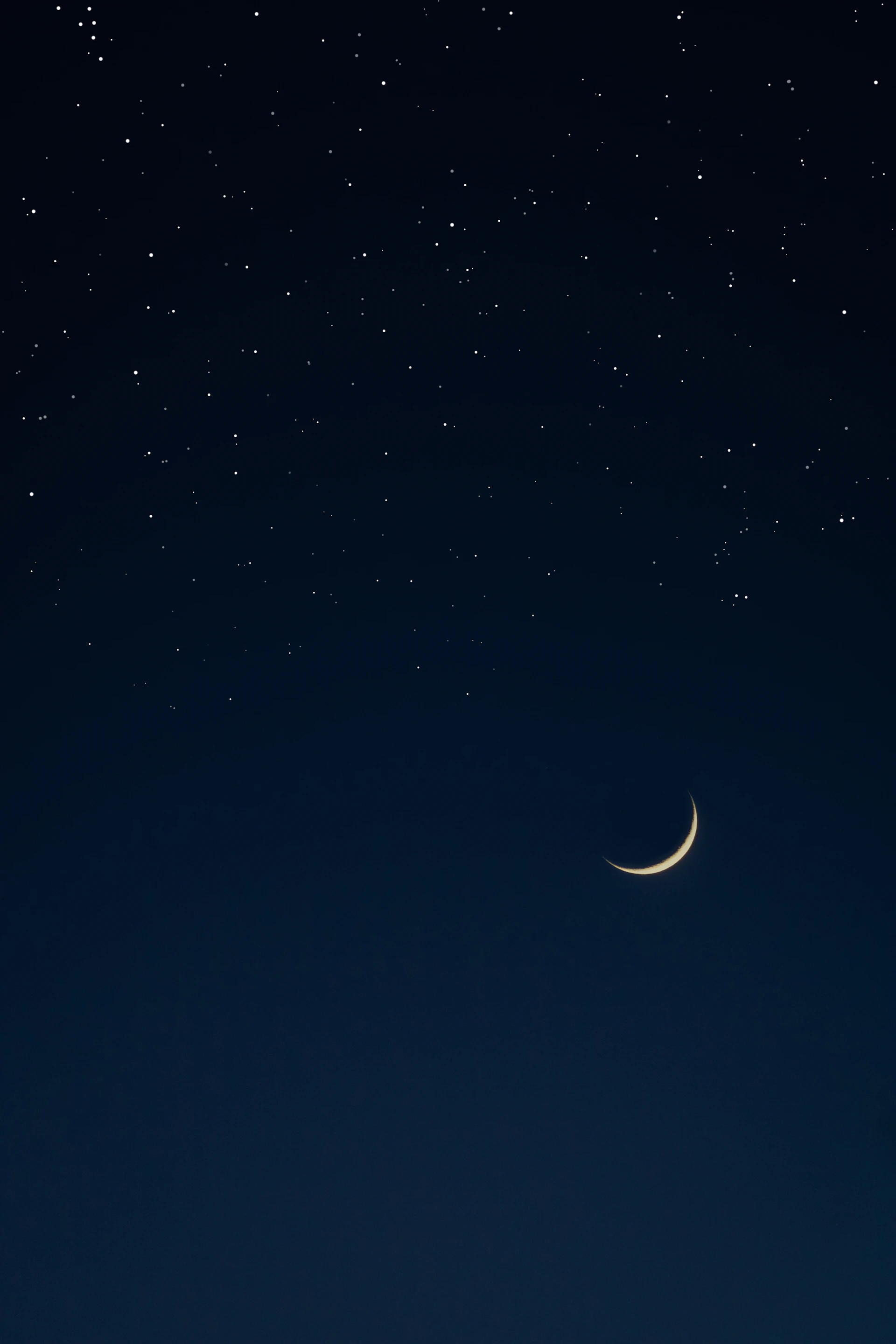 the moon and the stars in the night sky