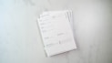 a stack of papers sitting on top of a white counter promoting free nutrition and wellness handouts