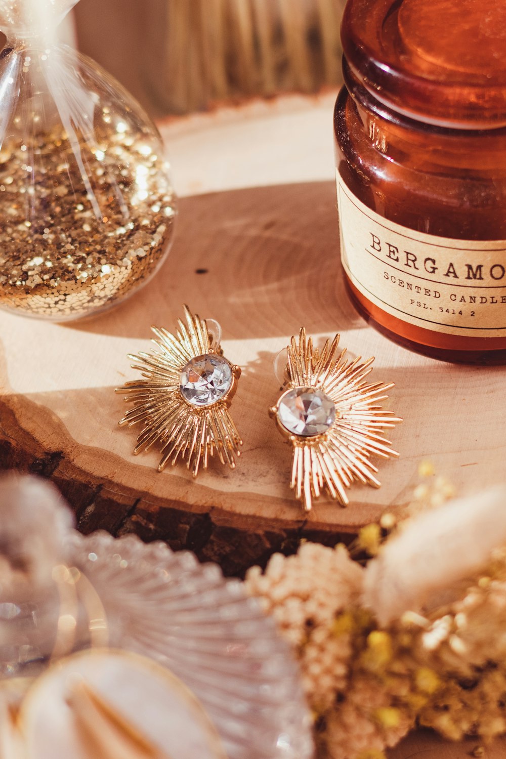 a close up of a pair of earrings on a table