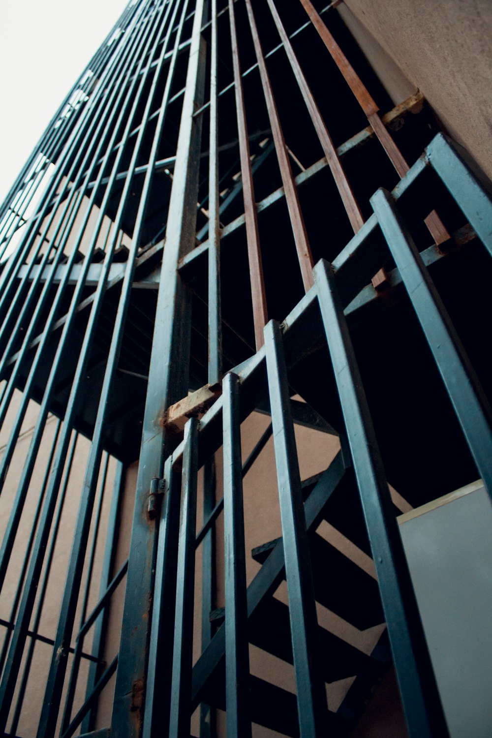 a tall building with metal bars on the side of it