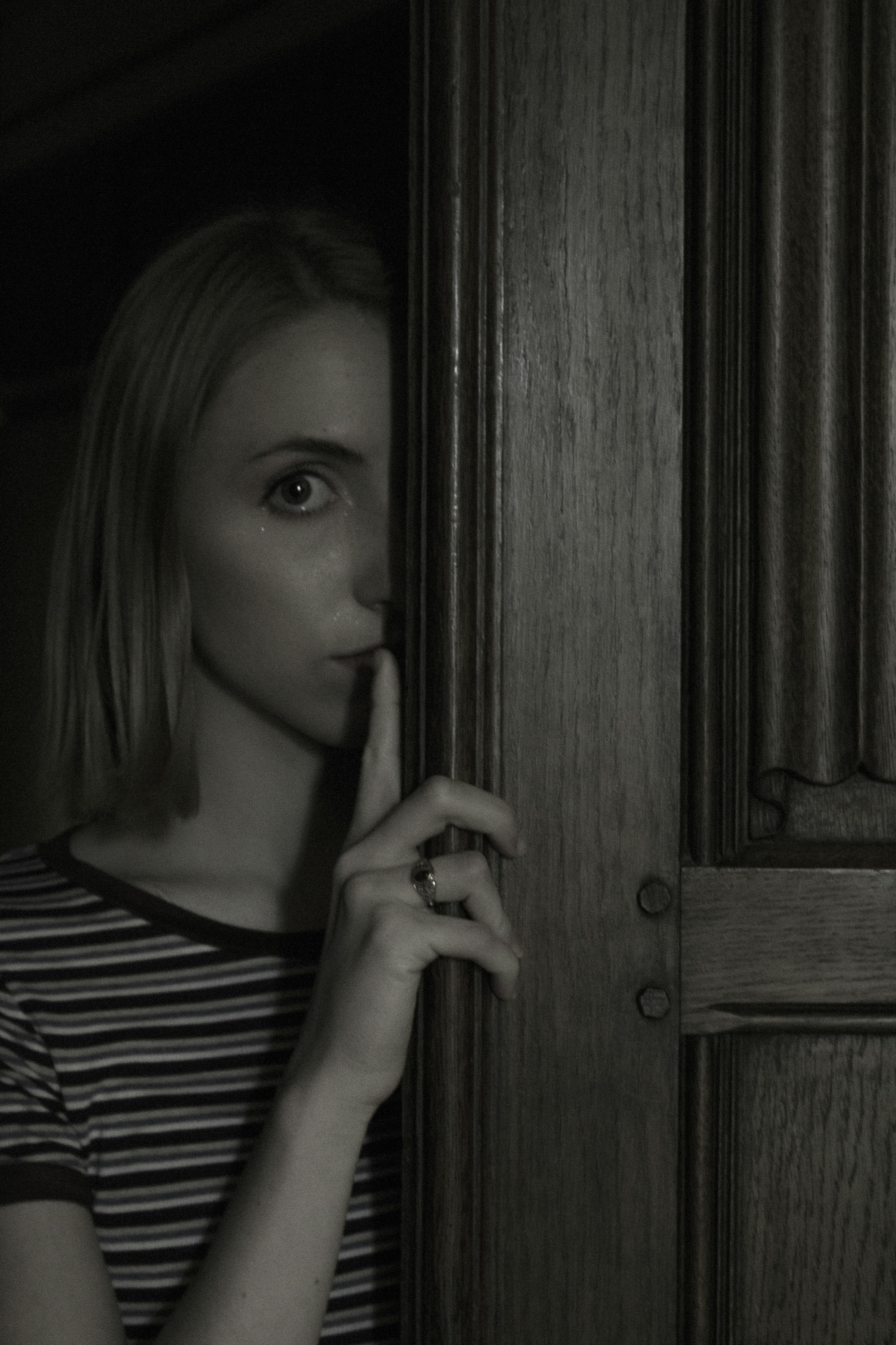 My sister behind an open door