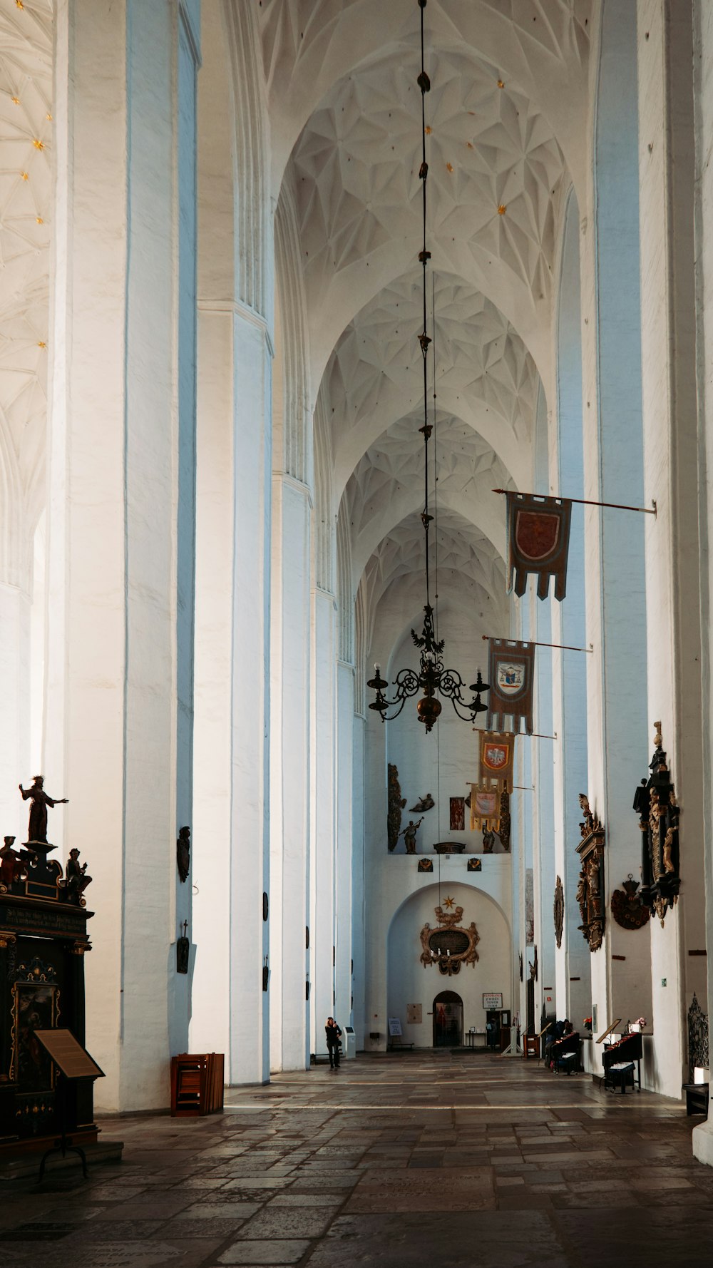 a large cathedral with a clock on the wall