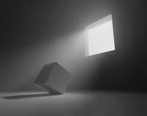 An empty room with a light coming from the ceiling