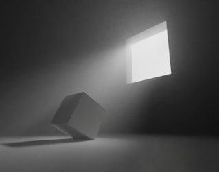 An empty room with a light coming from the ceiling